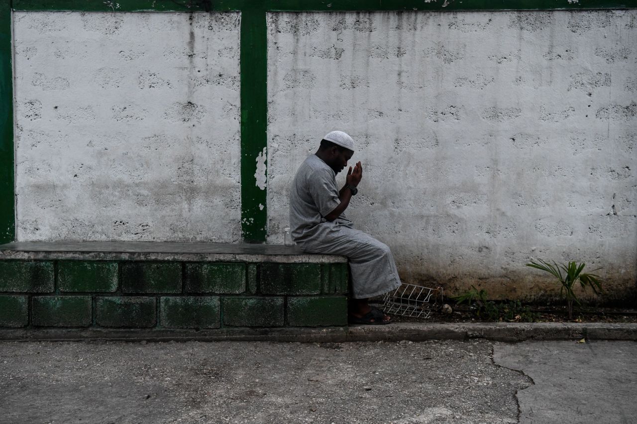 A Muslim man offer prayers prior iftar, the meal after sunset, at the Masjid At-Tawheed mosque on the first day of the Muslim holy month of Ramadan in Port-au-Prince on May 6.