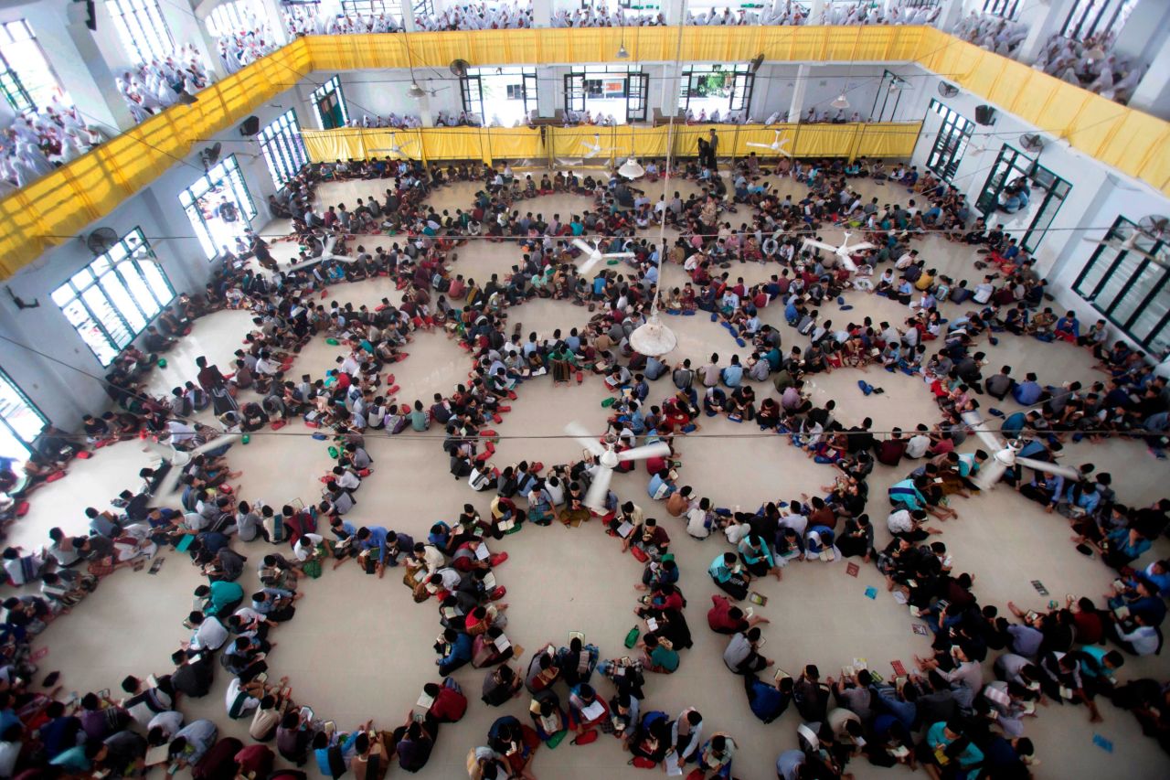 Students sit in circles as they attend a Quran recital class during the first day of the holy fasting month of Ramadan at Ar-Raudlatul Hasanah Islamic Boarding School in Medan, North Sumatra, Indonesia, Monday.