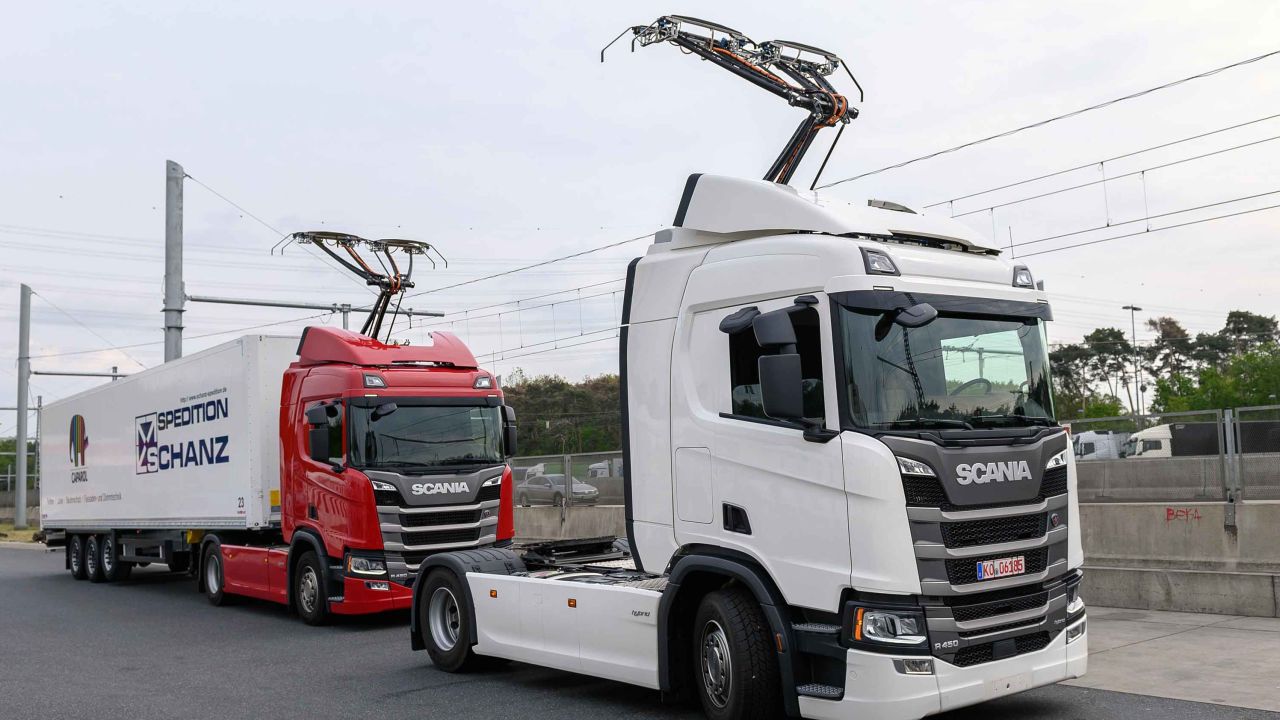 07 May 2019, Hessen, Darmstadt: Two Scania R450 Hybrid tractors with extended pantograph are about to start operating the first German test track for electric trucks with overhead contact line at a service area on motorway 5 (A5). The eHighway will be tested in public road traffic for the first time on the 10-kilometer test track between the Langen/M?rfelden and Weiterstadt junctions. Photo: Silas Stein/dpa (Photo by Silas Stein/picture alliance via Getty Images)