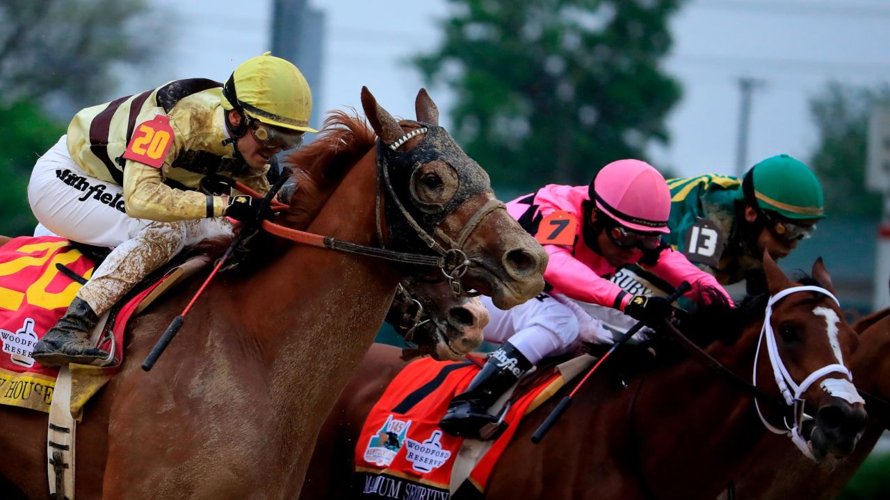Country House (#20) and  Maximum Security (#7) during the 145th running of the Kentucky Derby.