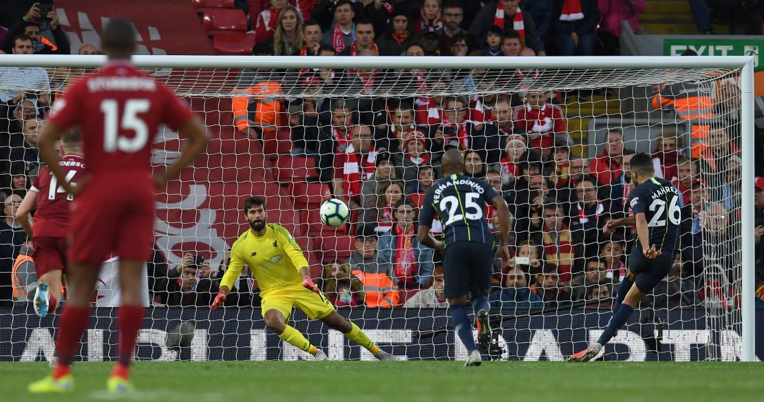 City's Riyad Mahrez misses a late penalty at Anfield as the game finishes goalless.