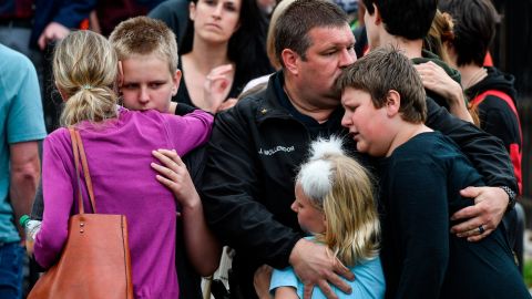 Parents reunite with children evacuated from STEM School Highlands Ranch after a shooting at the school.