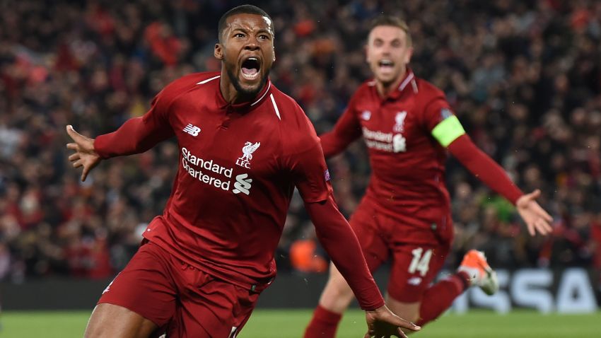 Liverpool's Dutch midfielder Georginio Wijnaldum celebrates after scoring their third goal during the UEFA Champions league semi-final second leg football match between Liverpool and Barcelona at Anfield in Liverpool, north west England on May 7, 2019. (Photo by Paul ELLIS / AFP)        (Photo credit should read PAUL ELLIS/AFP/Getty Images)