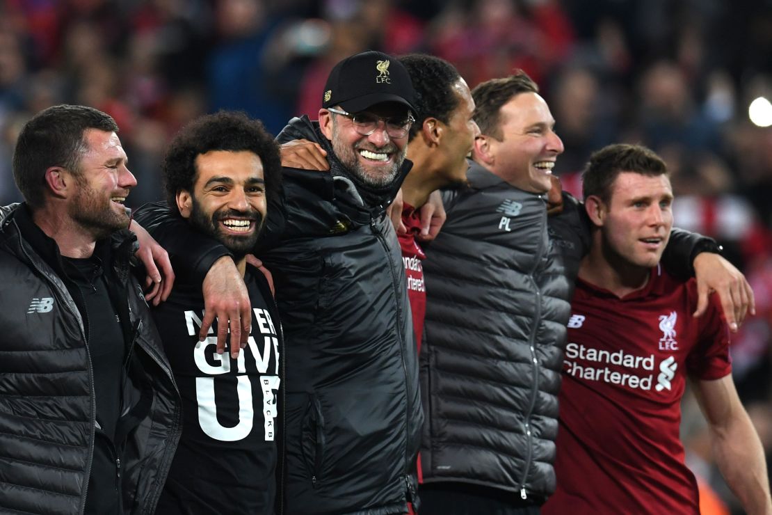 Mohamed Salah, Jurgen Klopp and Virgil van Dijk celebrate after Liverpool's remarkable win.