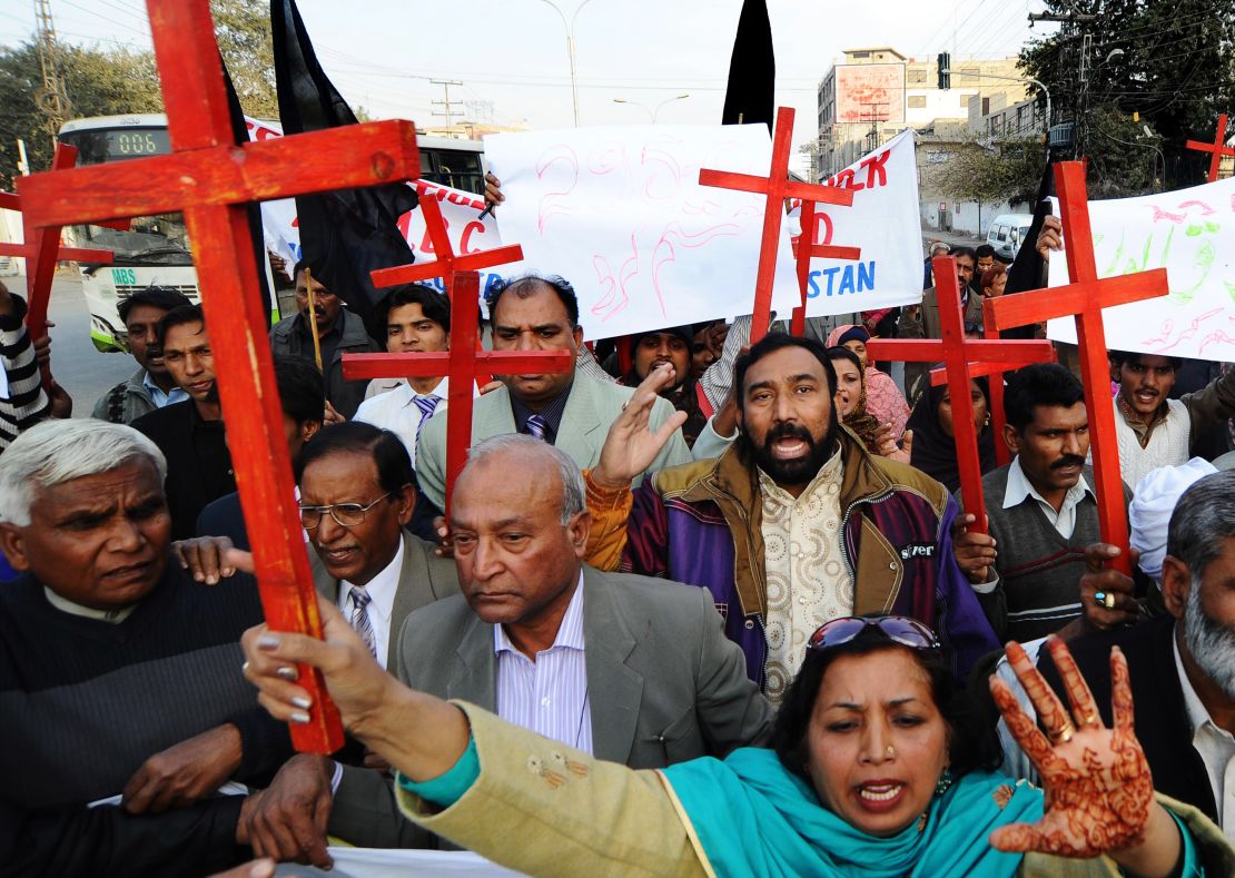Members of the Pakistan Christian Democratic alliance march during a protest in Lahore on December 25, 2010, in support of Asia Bibi.