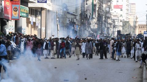 Pakistani Islamists react after the police use tear gas during a protest against the Supreme Court decision on Asia Bibi's case.