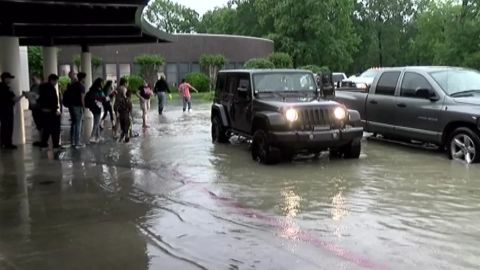 Many parents could not access roads to pick up their children in Cleveland, Texas, Tuesday.