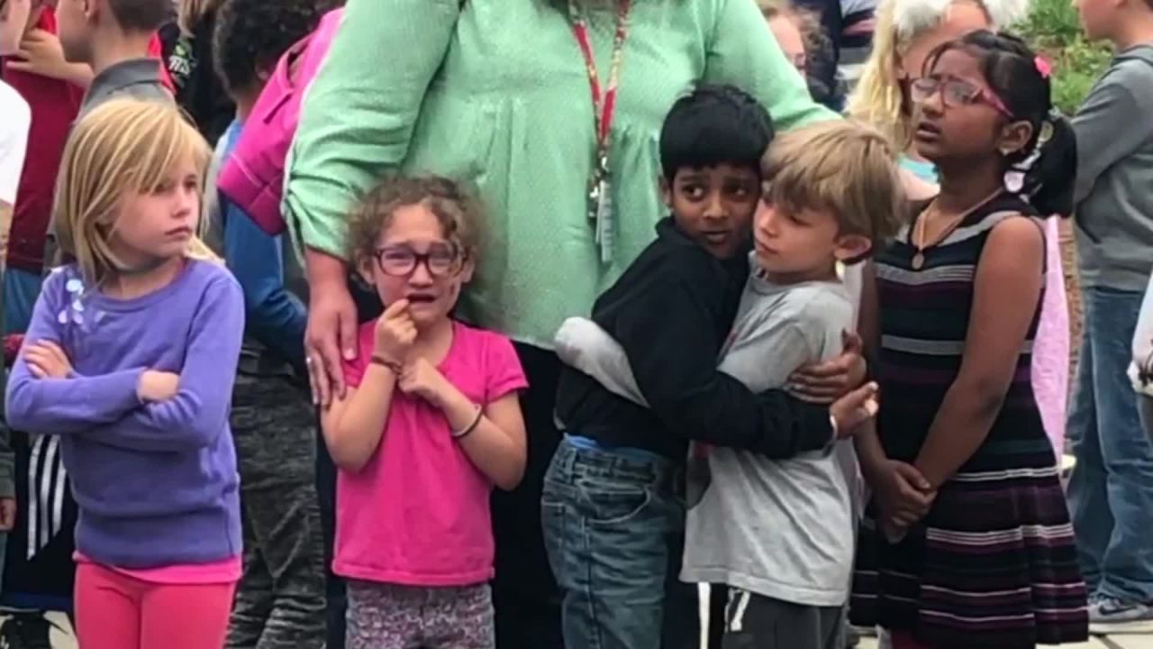 Children embrace each other after <a href="https://www.cnn.com/2019/05/08/us/gallery/denver-school-shooting-may-2019/index.html" target="_blank">the school shooting</a> in Highlands Ranch, Colorado, on Tuesday, May 7.