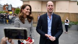 Britain's Catherine, Duchess of Cambridge (L) and Britain's Prince William, Duke of Cambridge talk to members of the media about their newborn nephew, as they arrive to launch the King's Cup Regatta, at the Cutty Sark in Greenwich, south east London on May 7, 2019. - The event is set to take place on August 9, 2019, on the Isle of Wight, and is set to see The Duke and Duchess go head to head as skippers of individual sailing boats, in an eight boat regatta race. Each boat taking part will represent one of eight charities and the winning team will be awarded the historic trophy The King's Cup. (Photo by Ben STANSALL / POOL / AFP)