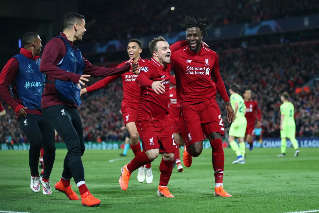 Origi (right) and Shaqiri celebrate after the Belgian scores Liverpool's fourth. 