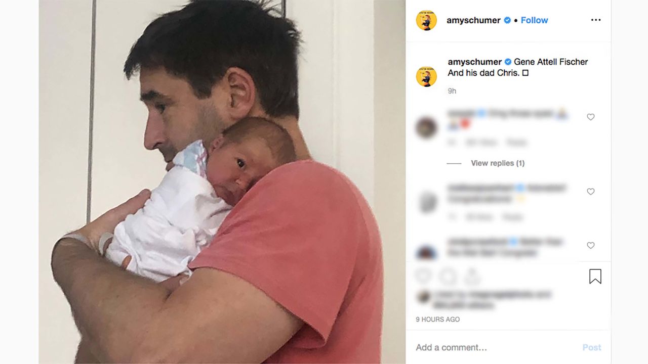 Amy Schumer posted a photo of her husband, Chris Fischer, holding their baby.
