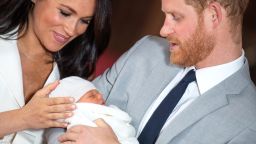 Prince Harry, Duke of Sussex and Meghan, Duchess of Sussex, pose with their newborn son Prince Archie Harrison Mountbatten-Windsor during a photocall in St George's Hall at Windsor Castle on May 8, 2019 in Windsor, England. The Duchess of Sussex gave birth at 05:26 on Monday 06 May, 2019.