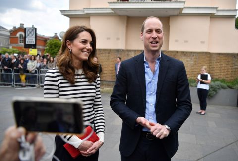 Harry's brother, Prince William, and William's wife Catherine, the Duchess of Cambridge, talk to the media about their new nephew on Tuesday, May 7.