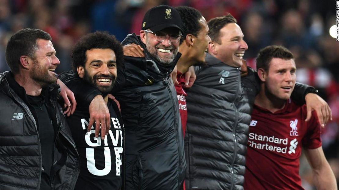 Liverpool players celebrate their stunning win over Barcelona.