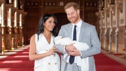 Britain's Prince Harry, Duke of Sussex (R), and his wife Meghan, Duchess of Sussex, pose for a photo with their newborn baby son, Archie Harrison Mountbatten-Windsor, in St George's Hall at Windsor Castle in Windsor, west of London on May 8, 2019. (Photo by Dominic Lipinski / POOL / AFP)        (Photo credit should read DOMINIC LIPINSKI/AFP/Getty Images)