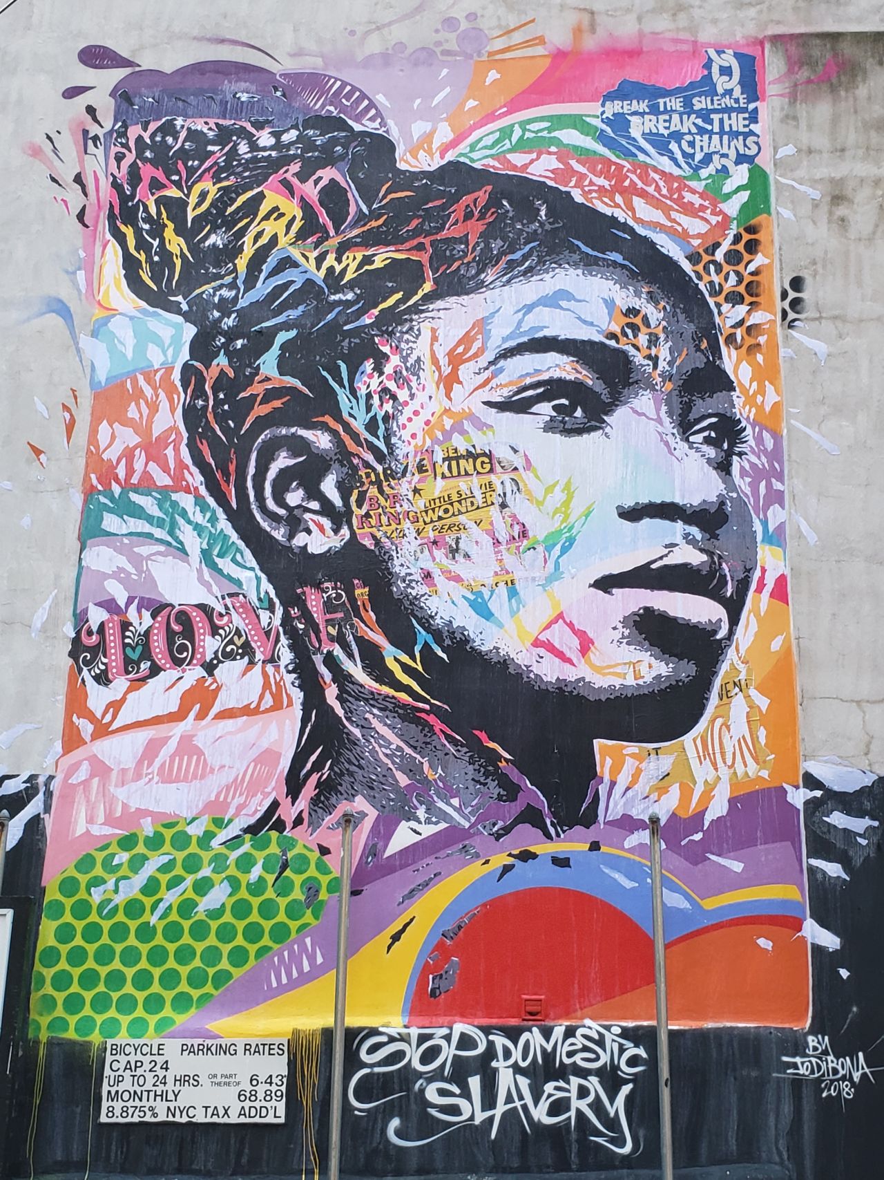Street Art for Mankind (SAM) uses art to campaign against human trafficking. Its latest project includes a series of murals in New York City that represent the experiences of victims of modern slavery. The images are meant as an "allegory of the issue," not a direct representation of the individual victims.<br />This image tells the story of Henriette, who migrated from Togo to France at the age of 14. She told SAM that her parents had sent her there to work for a woman in return for education. However, she says she did not go to school, and instead spent almost five years working in the house, sleeping on the floor and eating leftovers. French artist, Jo Di Bona created the mural, located on Cliff Street.