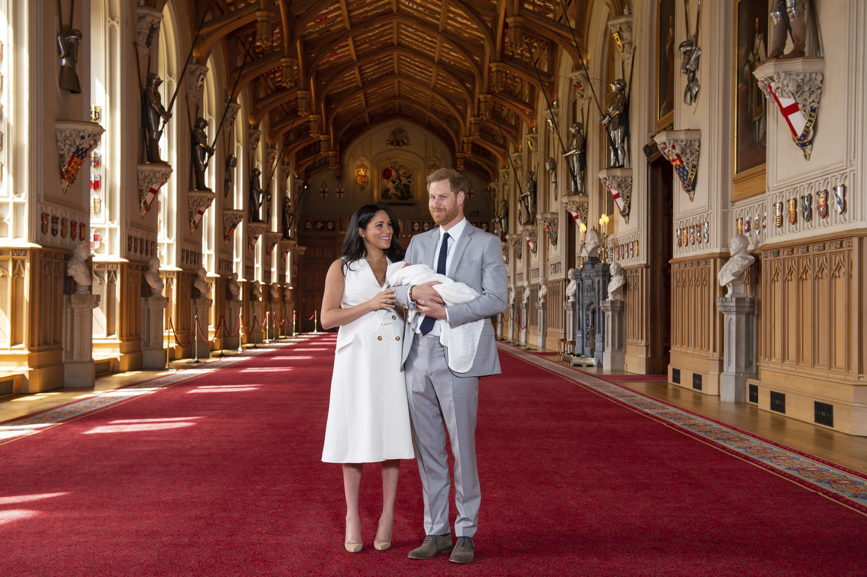 Britain's Prince Harry and his wife, Meghan, pose with their newborn son, Archie, at Windsor Castle on Wednesday, May 8.