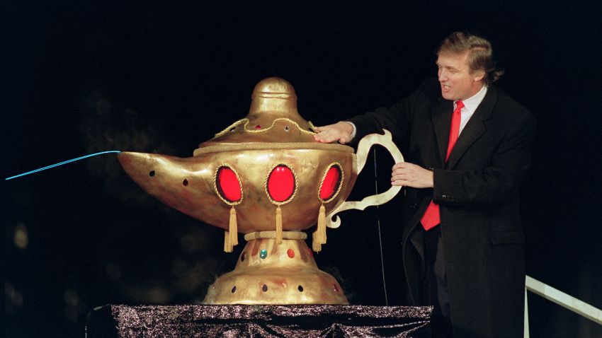 Real estate developer Donald J. Trump rubs a "magic lamp" during the opening ceremony for his huge Taj Mahal casino, in Atlantic city, 05 April 1990. 
Billionaire Donald Trump, who was born in 1946, Queens, New York, has gained notability for his celebrity lifestyle and his real estate successes. / AFP PHOTO / BILL SWERSEY        (Photo credit should read BILL SWERSEY/AFP/Getty Images)