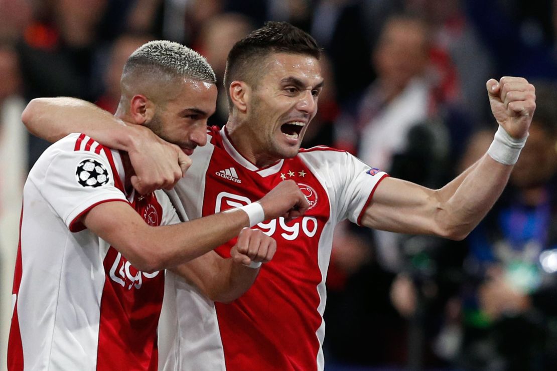 Hakim Ziyech (L) celebrates with teammate Dusan Tadic after scoring Ajax's second.