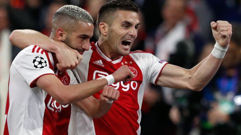 Hakim Ziyech (L) celebrates with teammate Dusan Tadic after scoring Ajax's second.