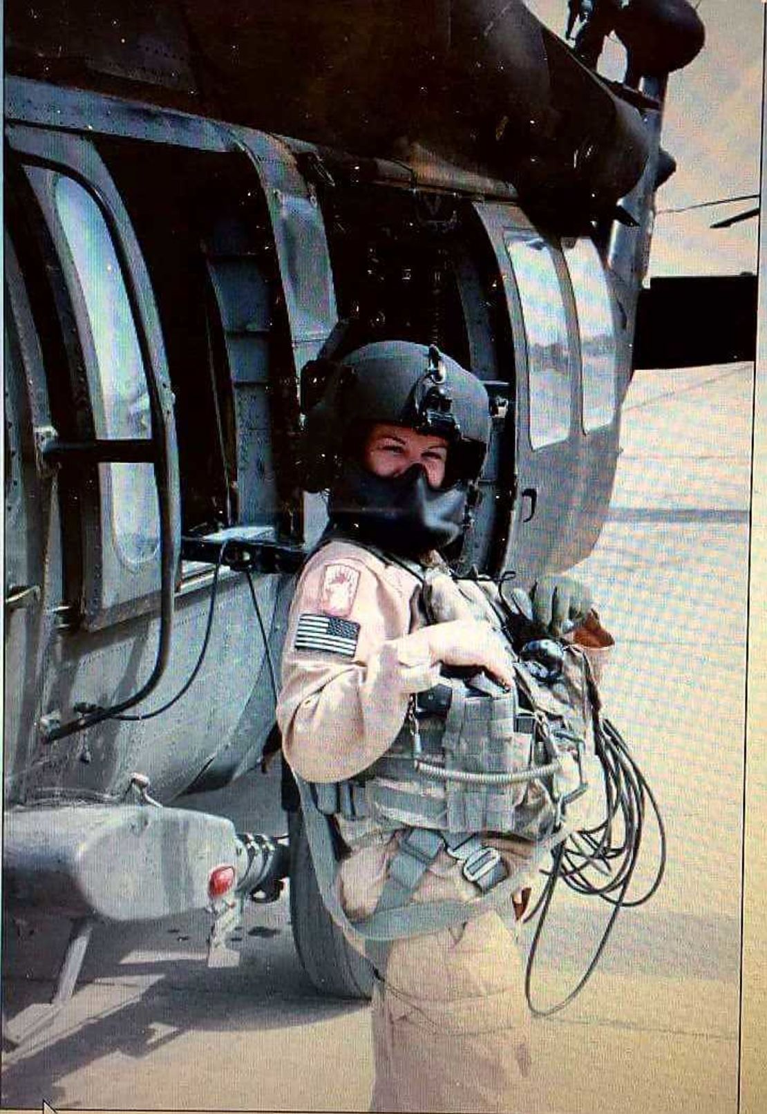 Harmony Allen with a Black Hawk helicopter during her Army training in 1999 at Fort Benning in GA. Allen served in the Army before joining the Air Force in 2000. 