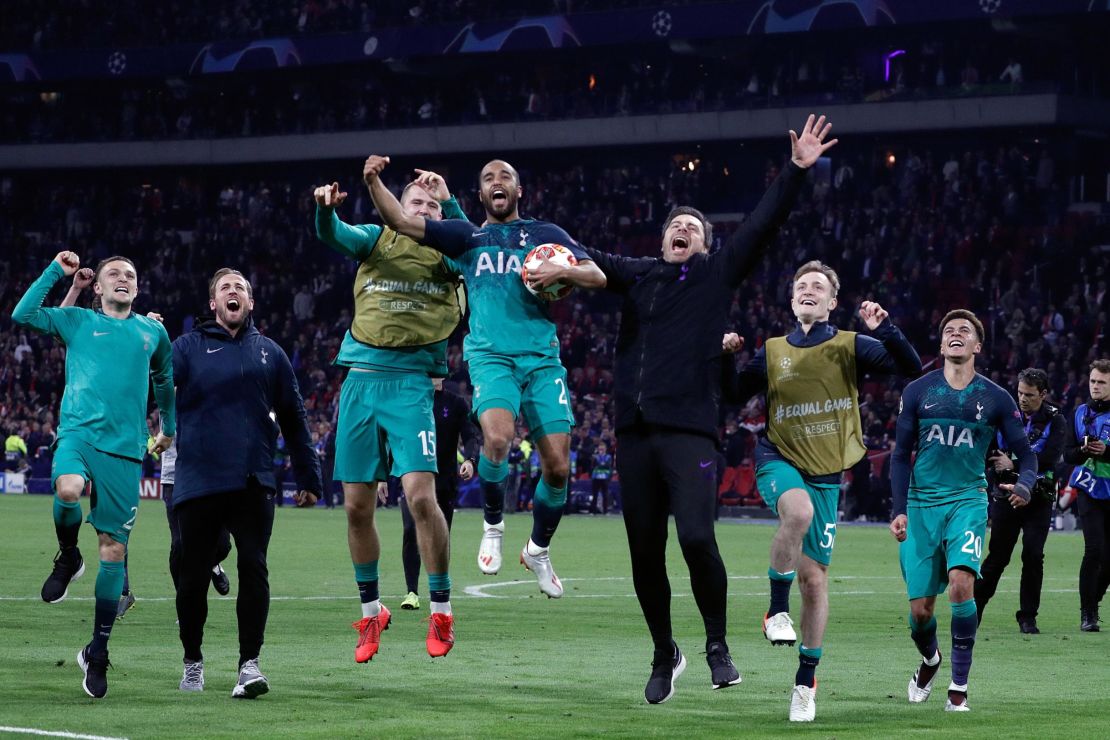Tottenham's Brazilian forward Lucas Moura celebrates with teammates at the end of the UEFA Champions League semifinal second leg match.