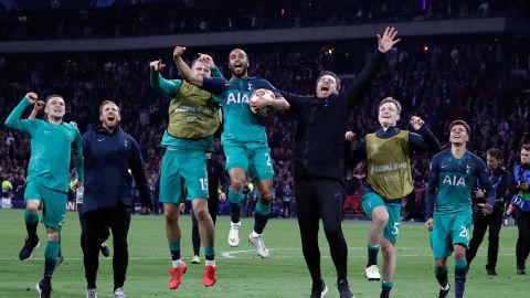 Tottenham's Brazilian forward Lucas (C) celebrates the victory with teammates.