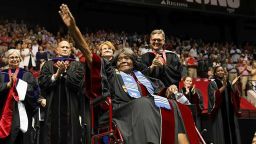 This photo provided by UA Strategic Communications Autherine Lucy Foster acknowledges the crowd as she receives a an honorary doctoral degree during a commencement exercise at The University of Alabama on Friday, May 3, 2019 in Tuscaloosa, Ala.  The university bestowed the honorary doctorate degree to Foster, the first African American to attend the university.  (Zach Riggins/UA Strategic Communications via AP)