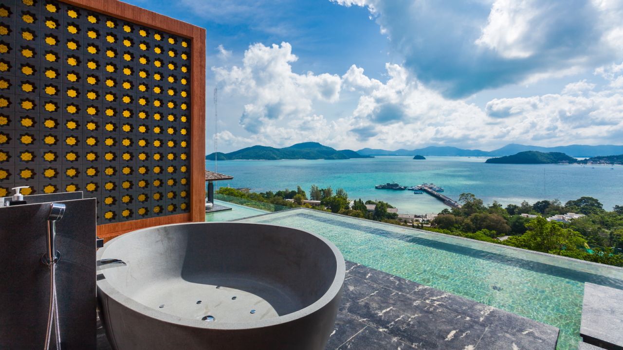 This bedroom in the X24 villa comes with its own outdoor bath tub.