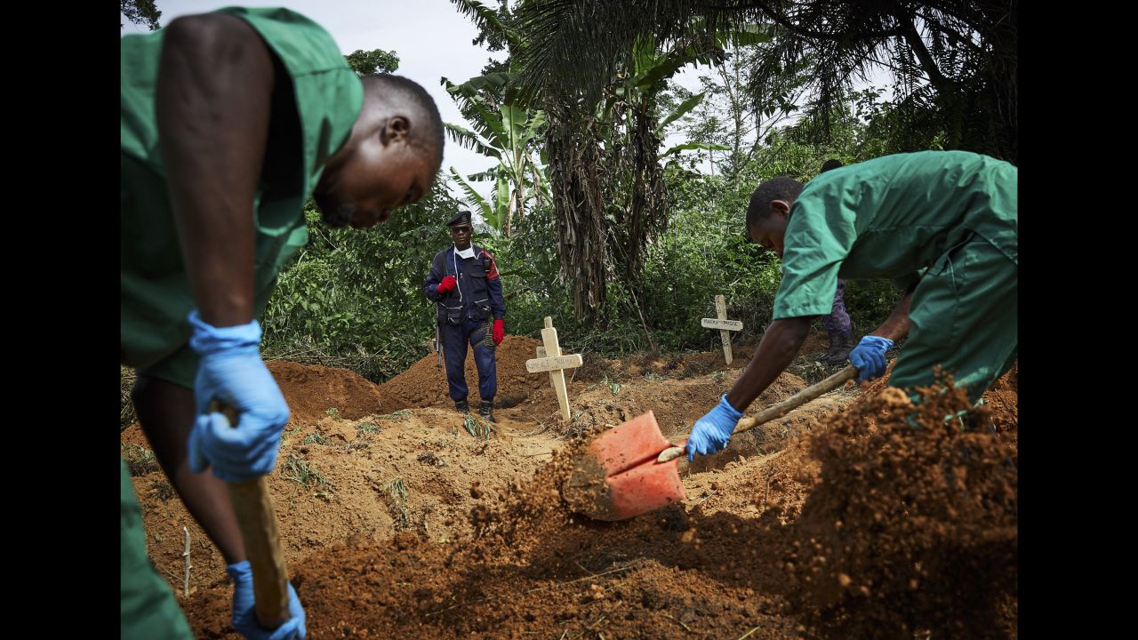 Health workers bury an 11-month-old child in Beni, Congo, on Sunday, May 5. <a href="https://www.cnn.com/2019/05/03/health/ebola-attacks-congo-africa-who-intl/index.html" target="_blank">An outbreak of Ebola,</a> which began in August, has killed more than 1,000 people, according to the country's Ministry of Health.