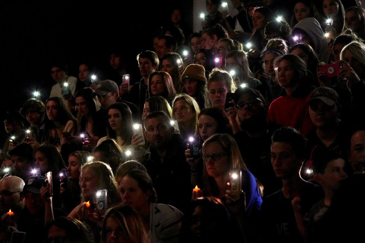 People use their cellphone lights during a vigil held Wednesday, May 8, for the victims of the school shooting in Highlands Ranch, Colorado.