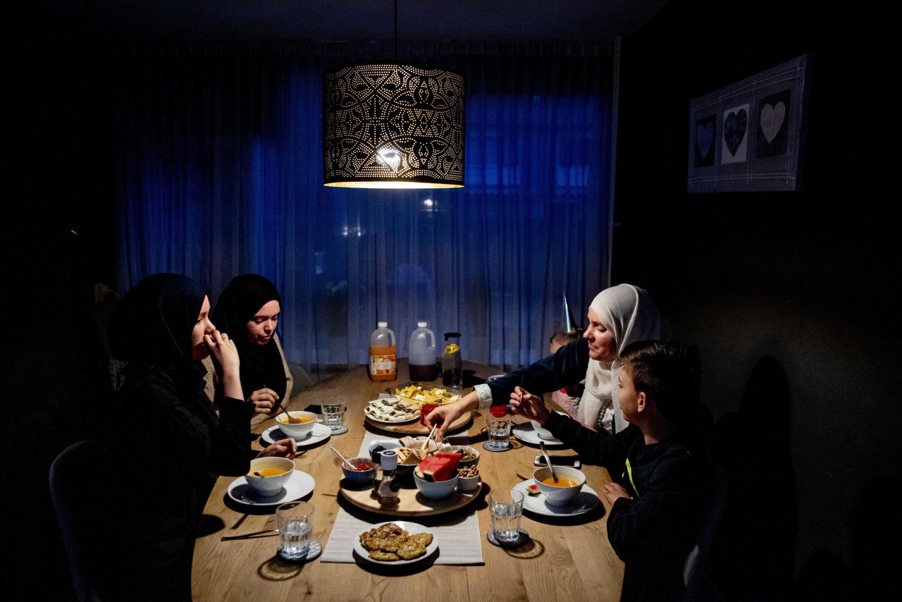 A Dutch Muslim family gathers during the Iftar, the meal after sunset during the Islamic month of fasting Ramadan in Rotterdam, The Netherlands.