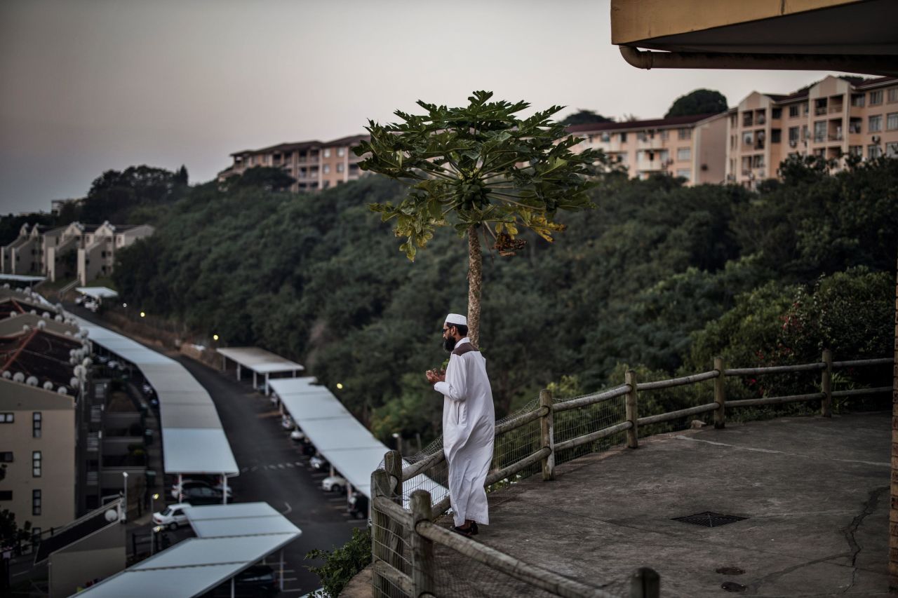 A man prays before breaking his fast during an Iftar at the Sufi Bhaijaan Darbaar Mosque in Durban, South Africa, on May 7.