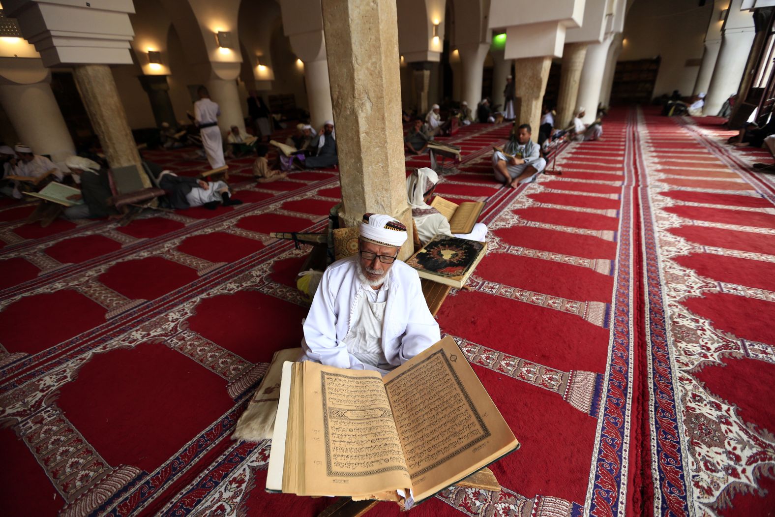 A Yemeni man reads the Quran at the Great Mosque in the old city of the capital Sanaa on May 9.