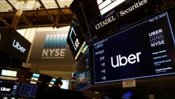 Screens display the Uber Technologies Inc. logo on the floor of the New York Stock Exchange (NYSE) during the company's IPO in New York, U.S., May 10, 2019. REUTERS/Andrew Kelly