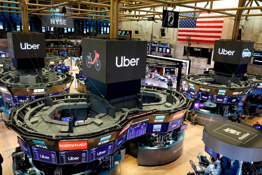 Uber logos top trading posts on the floor of the New York Stock Exchange on Friday.