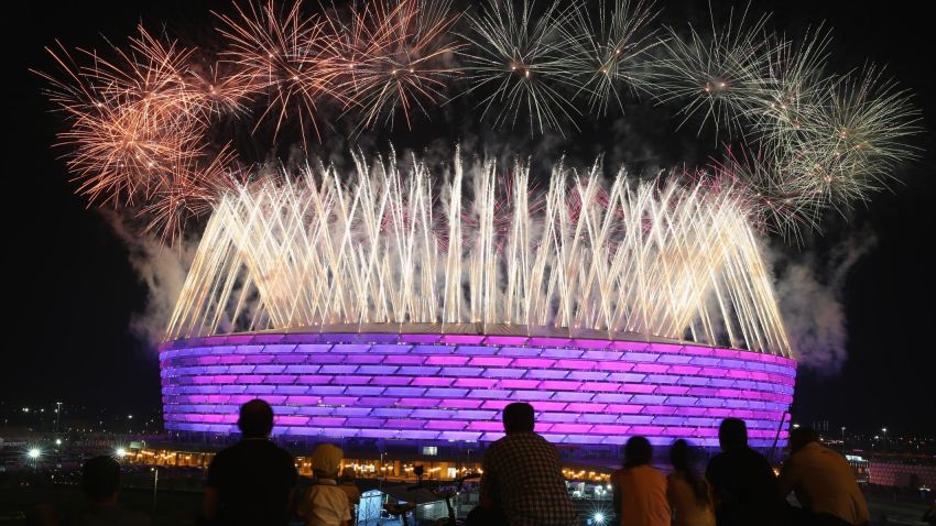 BAKU, AZERBAIJAN - JUNE 28:  Fireworks explode as locals look on outside the Olympic Stadium during the Closing Ceremony for the Baku 2015 European Games at xxx on June 28, 2015 in Baku, Azerbaijan.  (Photo by Michael Steele/Getty Images for BEGOC)