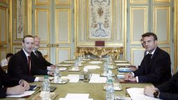 Facebook CEO Mark Zuckerberg, left, and French President Emmanuel Macron met to discuss  how to regulate social media. 