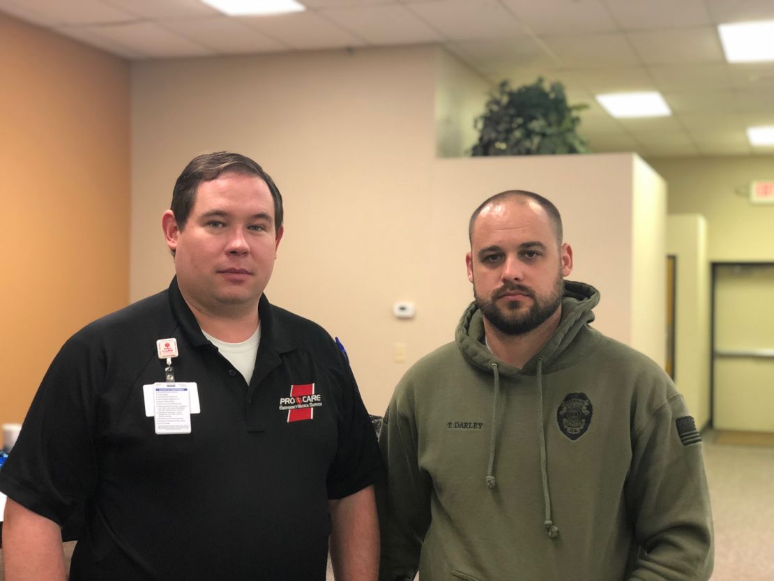 Dr. Hudson Garrett, left, and Officer Travis Darley pose for a picture after instructing a Stop the Bleed class on May 11, 2019.