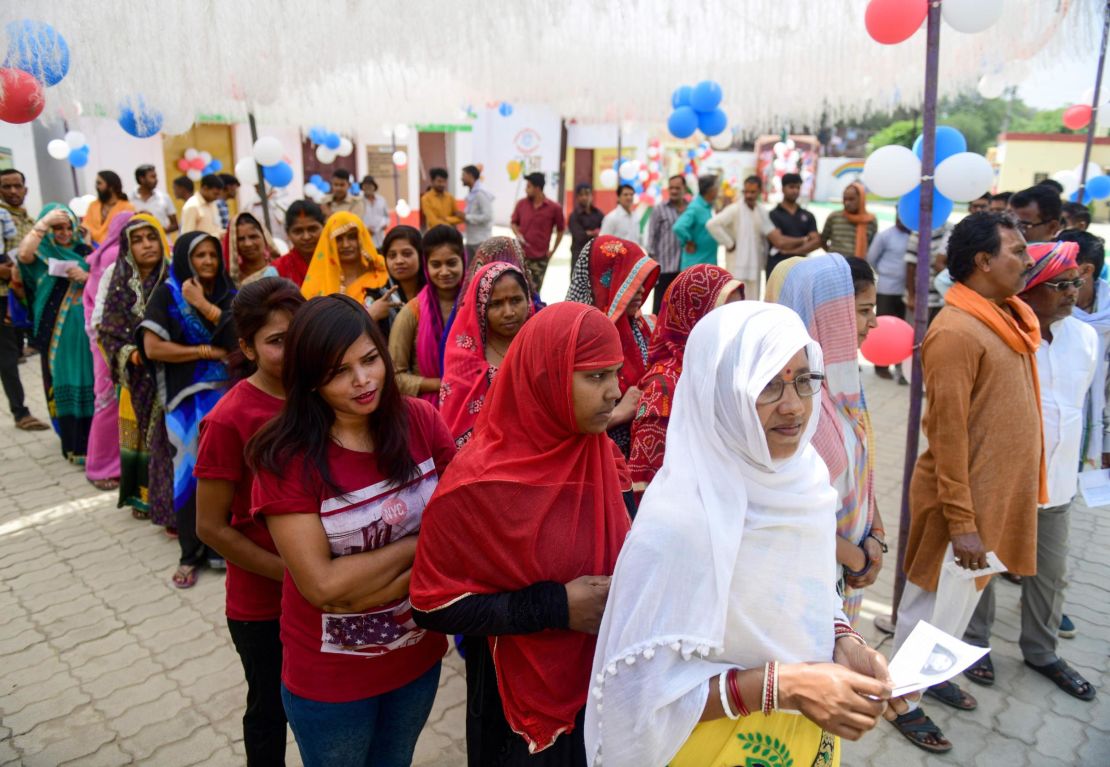 Indian voters queue at a polling station to cast their vote in Allahabad in Uttar Pradesh state on May 12, 2019, for the sixth phase of India's general election. 