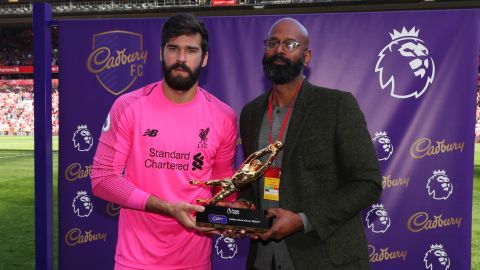 Alisson was handed the Premier League's Golden Glove trophy after the final game of the season.