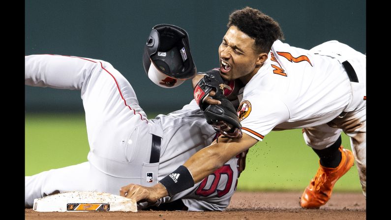 Richie Martin of the Baltimore Orioles collides with Eduardo Nunez of the Boston Red Sox as he steals second base during the eighth inning of a game on May 8, 2019, at Oriole Park at Camden Yards in Baltimore.