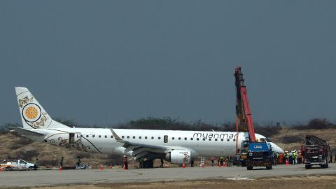 A general view shows a Myanmar National Airlines passenger plane after an emergency landing at Mandalay international airport on May 12, 2019.