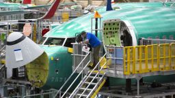 Employees work on Boeing 737 MAX airplanes at the Boeing Renton Factory in Renton, Washington on March 27, 2019. - Embattled aviation giant Boeing will do all it can to prevent future crashes like the two that killed nearly 350 people in recent months, a company official said. Boeing gathered hundreds of pilots and reporters at its factory to unveil a fix to the flight software of its grounded 737 MAX aircraft, which has been implicated in the latest air disasters. (Photo by Jason Redmond / AFP)        (Photo credit should read JASON REDMOND/AFP/Getty Images)