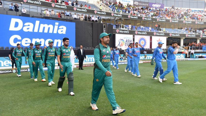 Indian and Pakistan (L) players line up before the start of the one day international (ODI) Asia Cup cricket match between Pakistan and India at the Dubai International Cricket Stadium in Dubai on September 19, 2018. (Photo by ISHARA S. KODIKARA / AFP)        (Photo credit should read ISHARA S. KODIKARA/AFP/Getty Images)