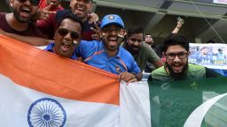 Indian and Pakistan cricket fan cheer in support of their national team during the one day international (ODI) Asia Cup cricket match between Pakistan and India at the Dubai International Cricket Stadium in Dubai on September 19, 2018. (Photo by Ishara S. KODIKARA / AFP)        (Photo credit should read ISHARA S. KODIKARA/AFP/Getty Images)