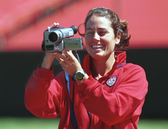 For younger readers, a camcorder is, according to the dictionary, a portable combined video camera and video recorder. USA co-captain Julie Foudy records her teammates at Stanford Stadium. Her footage would later feature in a documentary about the team. 
