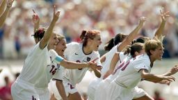 PASADENA, CA - JULY 10:  Joy Fawcett #14 Kate Sobrero #20 and Tisha  Venturini #15 of Team USA celebrate their victory in the Women's World Cup at The Rose Bowl on July 10, 1999 in Pasadena, California. (Photo by Elsa/Getty Images)