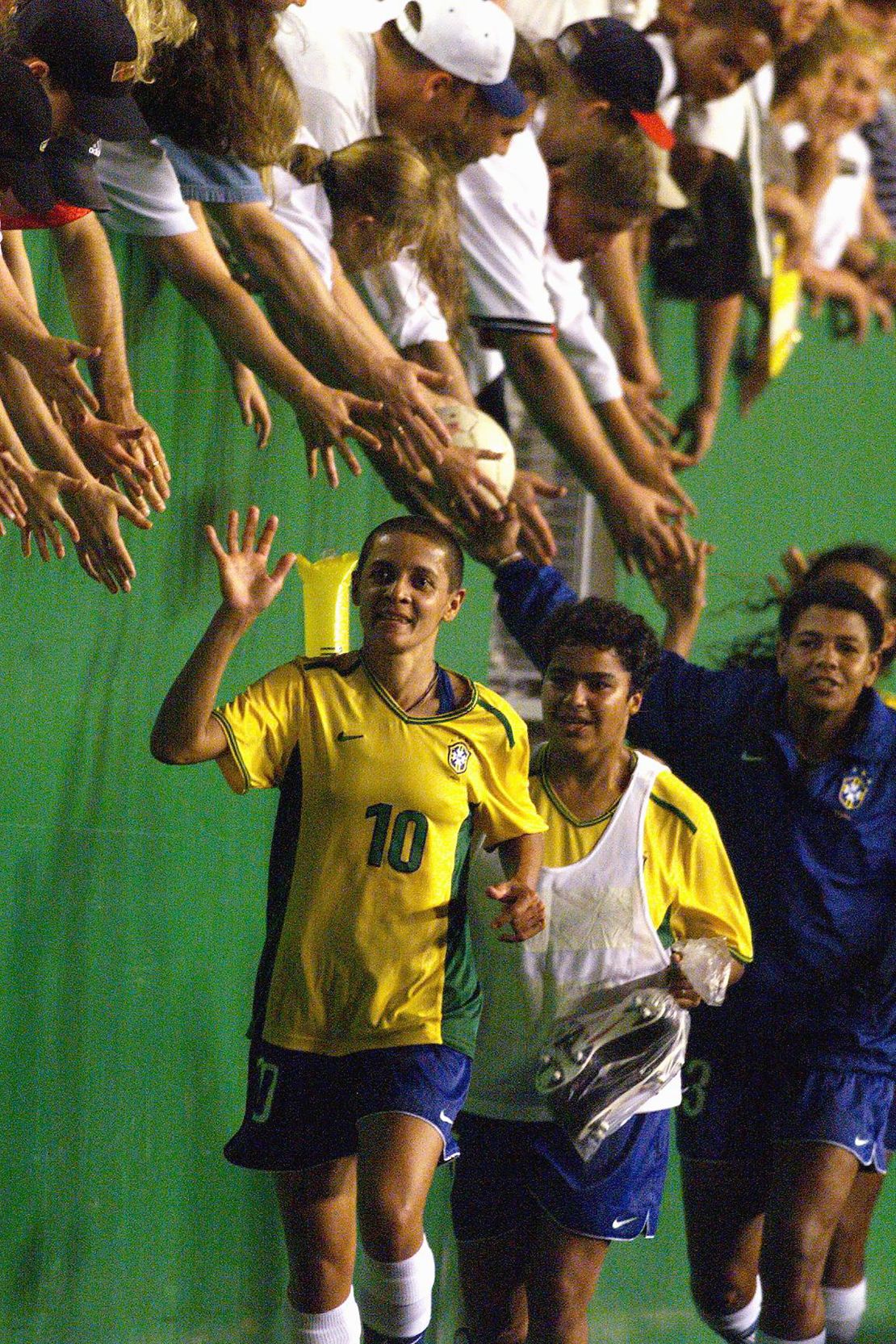 Sissi celebrates with teammates and fans after her match-winning free-kick.