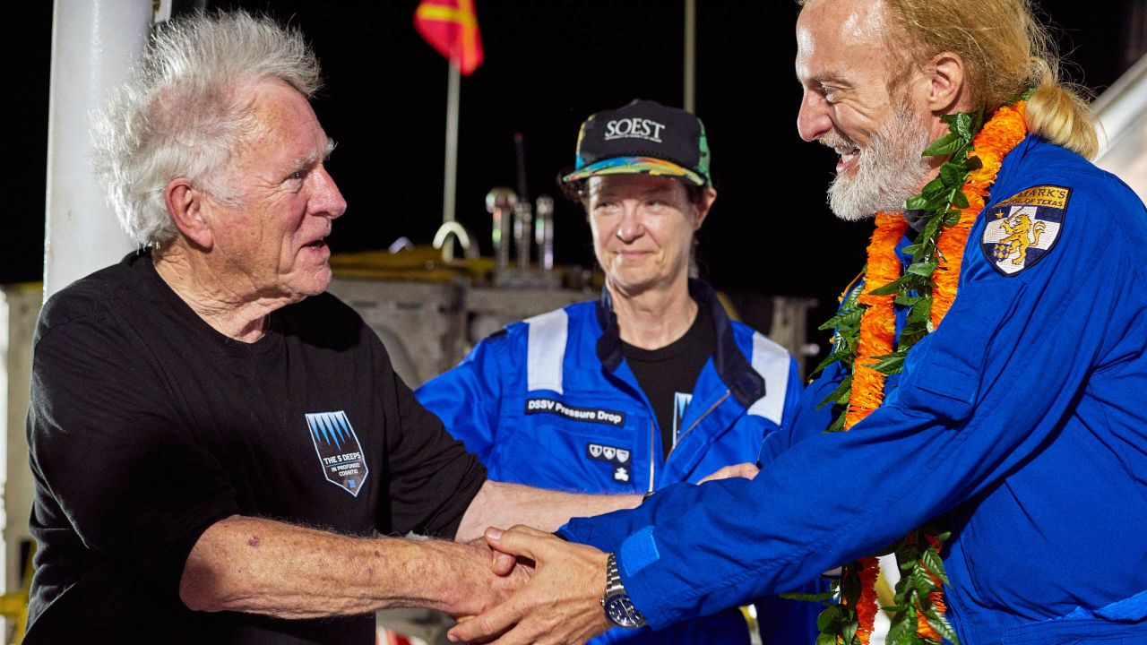 <strong>Original mission: </strong>Don Walsh, left, who first explored the Mariana Trench in 1960, was on hand to congratulate Vescovo after his record-breaking dive. 